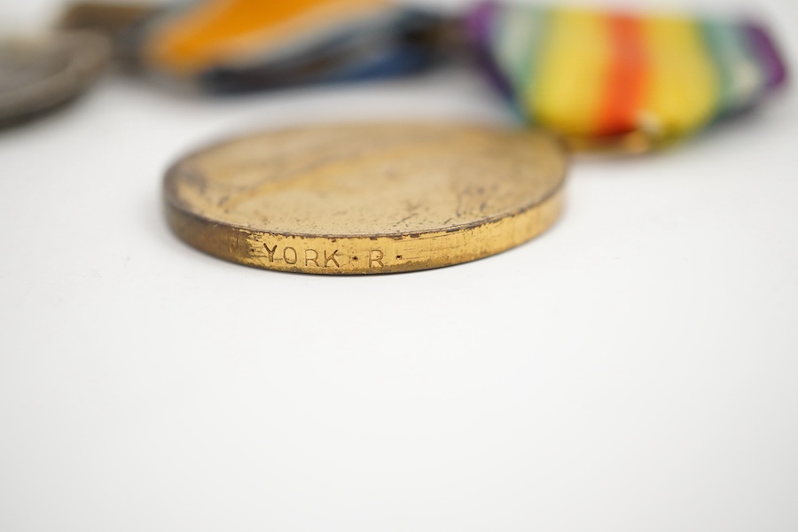 A George V First World War Military Cross (MC) medal group, comprising of a military cross, British war medal, and the victory medal. Condition - poor, the name of the recipient has been removed leaving only ‘W. York R.’